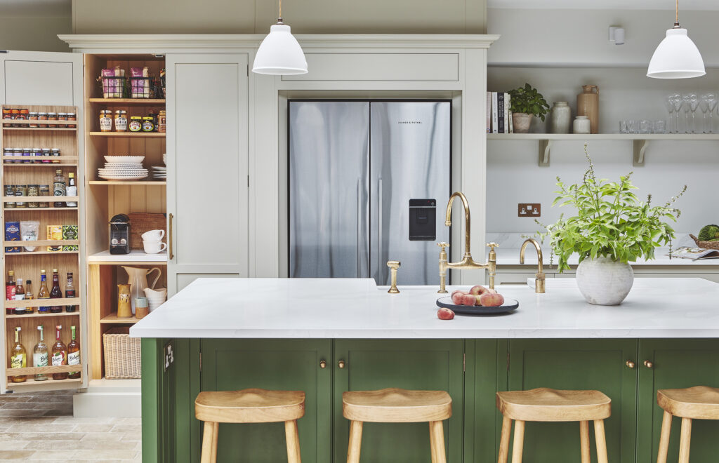 Green and white kitchen with modern design and American fridge freezer