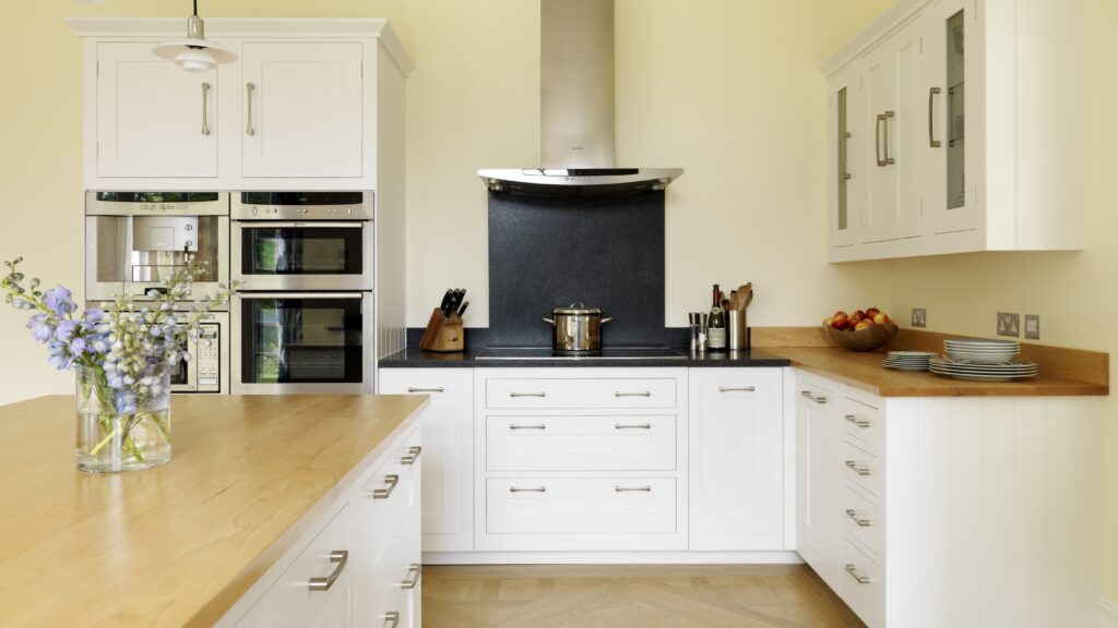Classic white shaker kitchen with natural wooden worktops