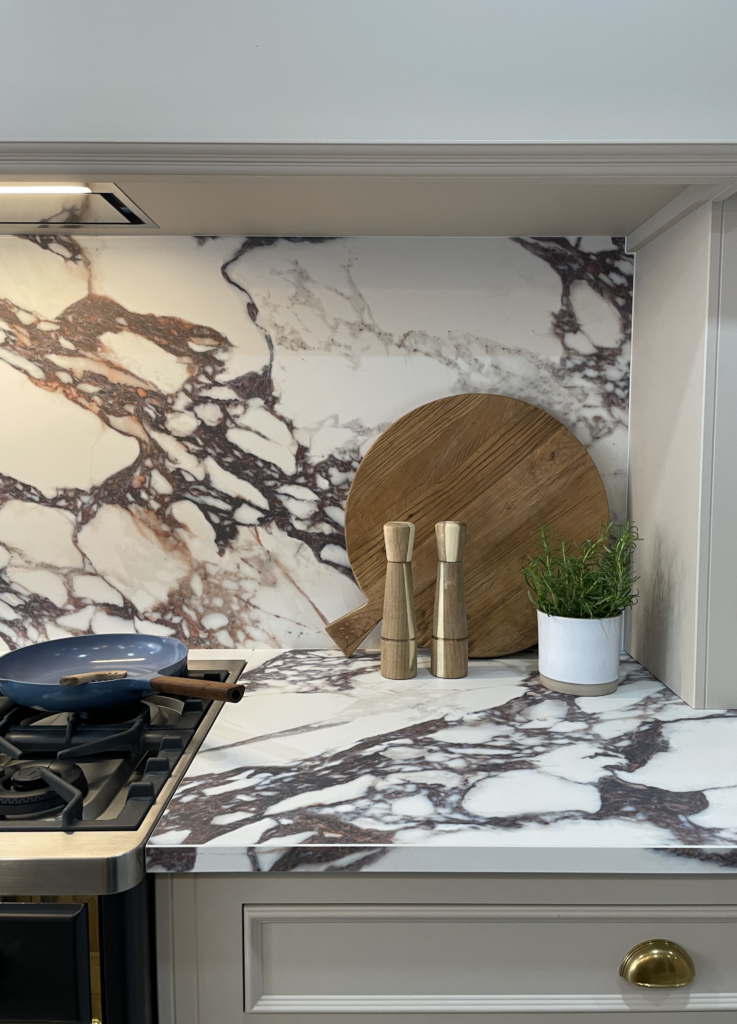Calacatta viola marble worktop and backsplash in a neutral luxury kitchen design