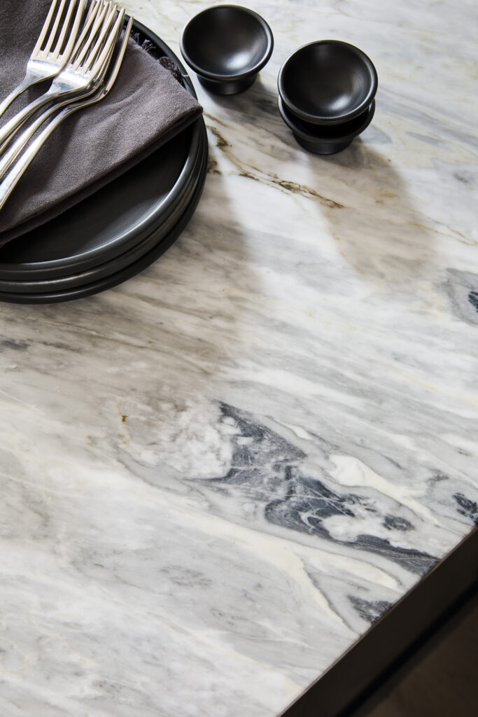 Marble worktop close up with grey and blue veining in a luxury kitchen