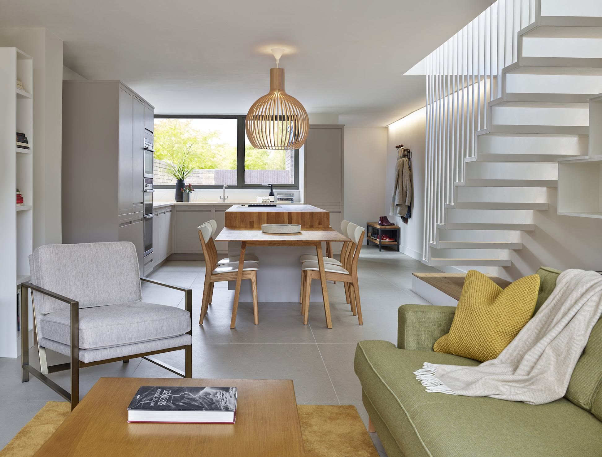 Open plan living area, dining area and Linear Edge kitchen design with a natural colour scheme