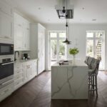 White and grey marble kitchen island waterfall edge