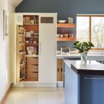 White Linear pantry open to reveal organised storage