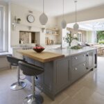 Grey kitchen island with grey stools