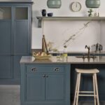 Rich blue Arbor kitchen island with wooden stool