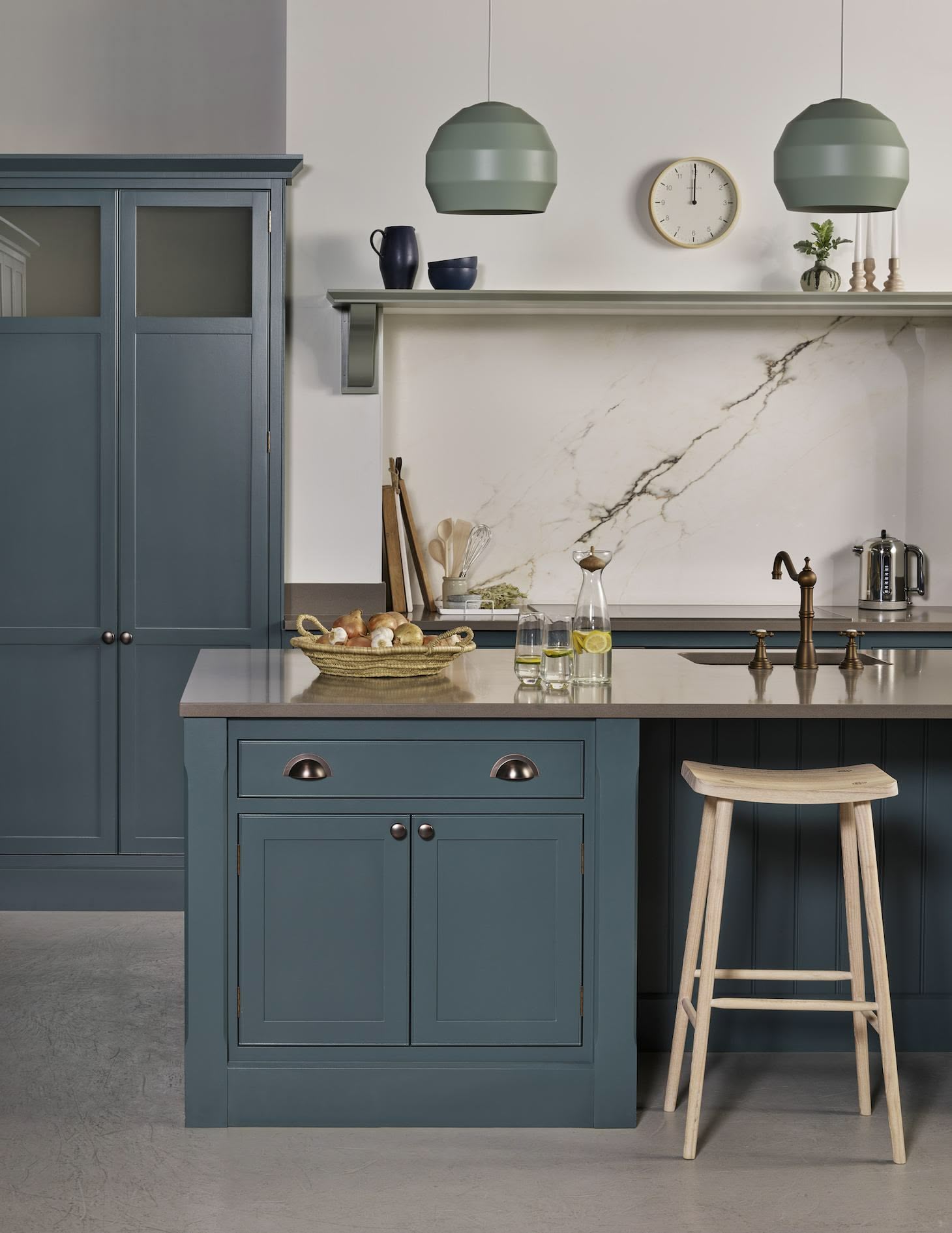 Rich blue Arbor kitchen island with wooden stool