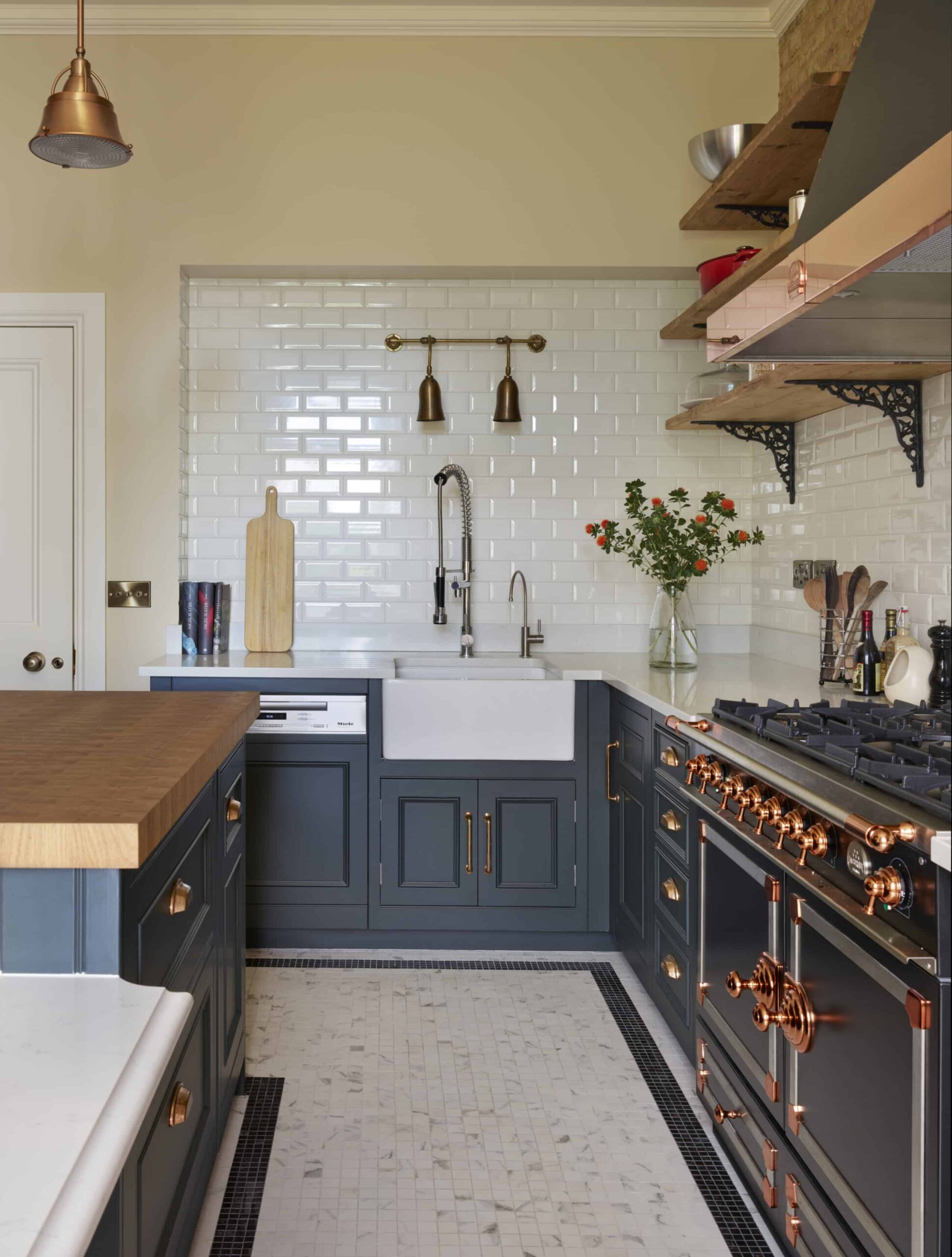 Dark Original kitchen cabinetry with copper handles