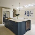 Blue Orginal design kitchen island with white worktop and silver handles