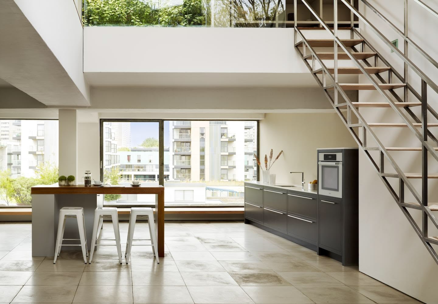 Open plan low level kitchen design next to stairs