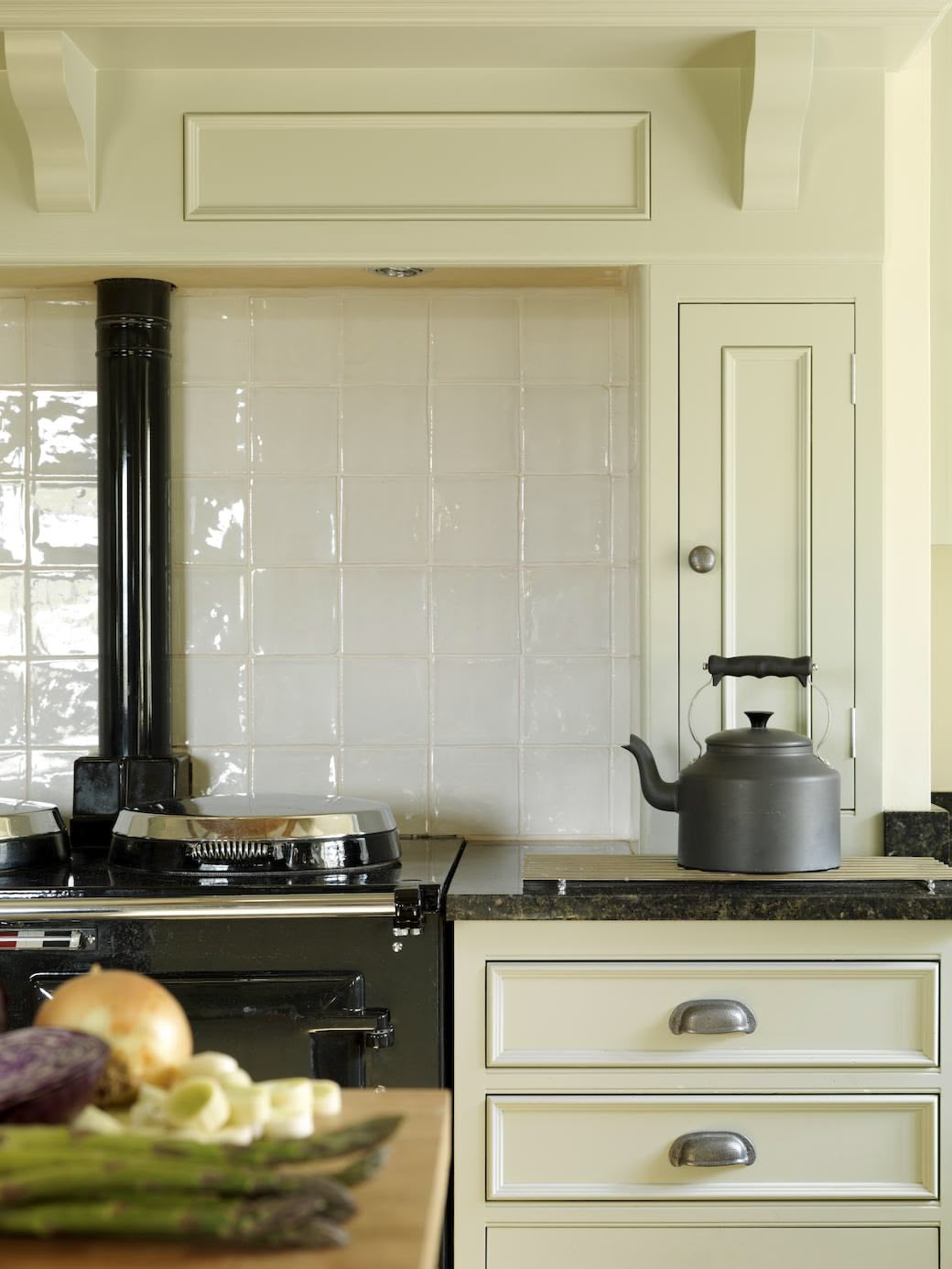 Sage green Original kitchen cabinetry with silver handles