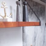 quartzite splashback and wooden shelving