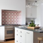 White Arbor kitchen design featuring pink and white decorative tiling around the cooker area