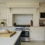 Cream Original kitchen cabinetry with white worktops