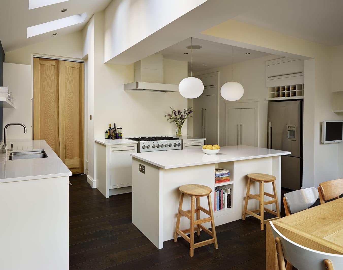 Low level kitchen design with white cabinetry