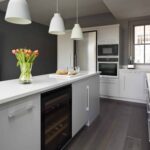 Grey kitchen island with integrated oven