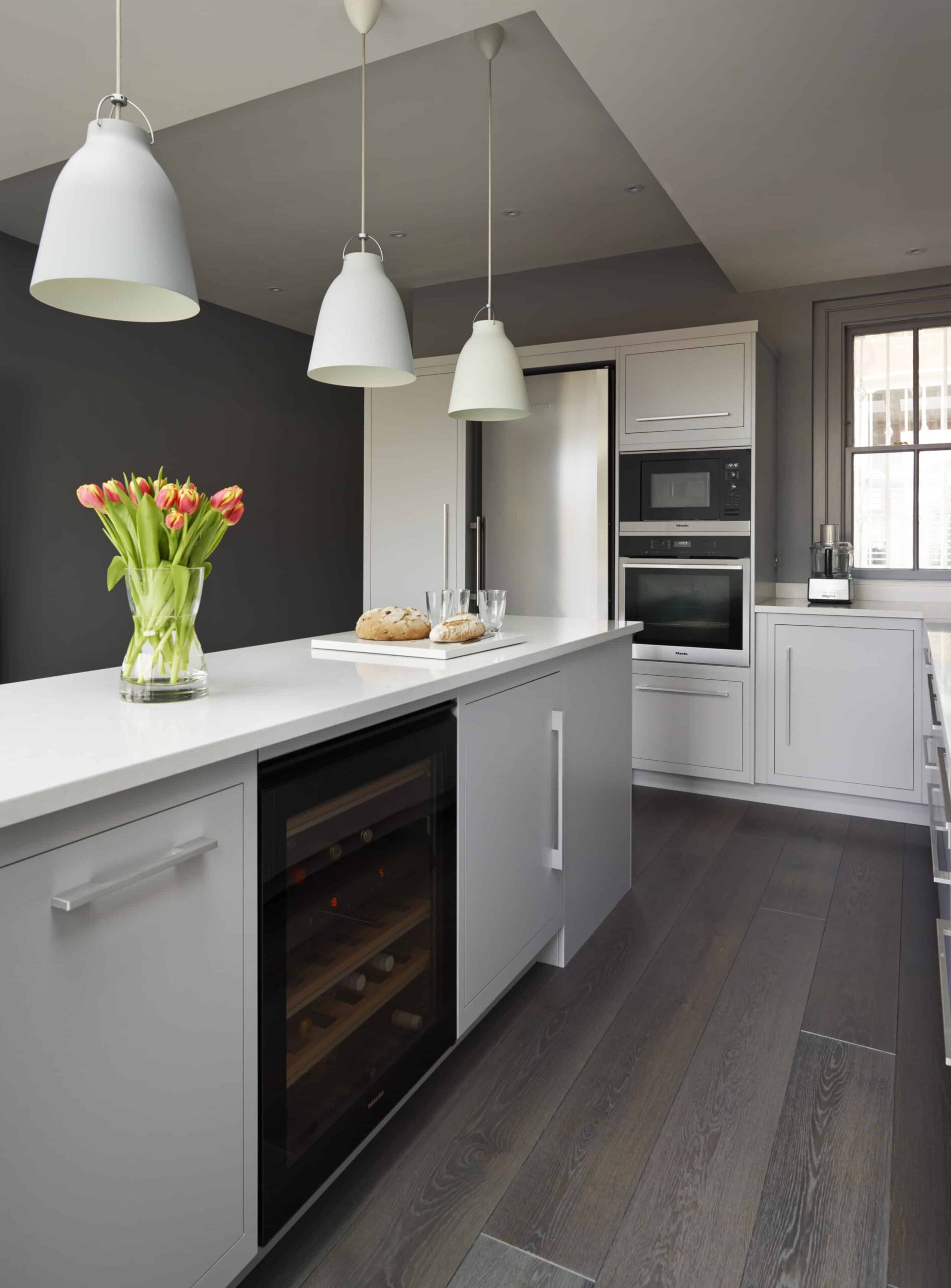 Grey kitchen island with integrated oven