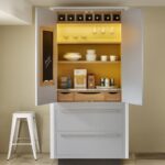 Large white pantry unit open to reveal organised shelving and drawers