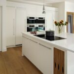White kitchen island with integrated oven