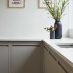 Beige Linear Edge kitchen cabinetry with white worktop