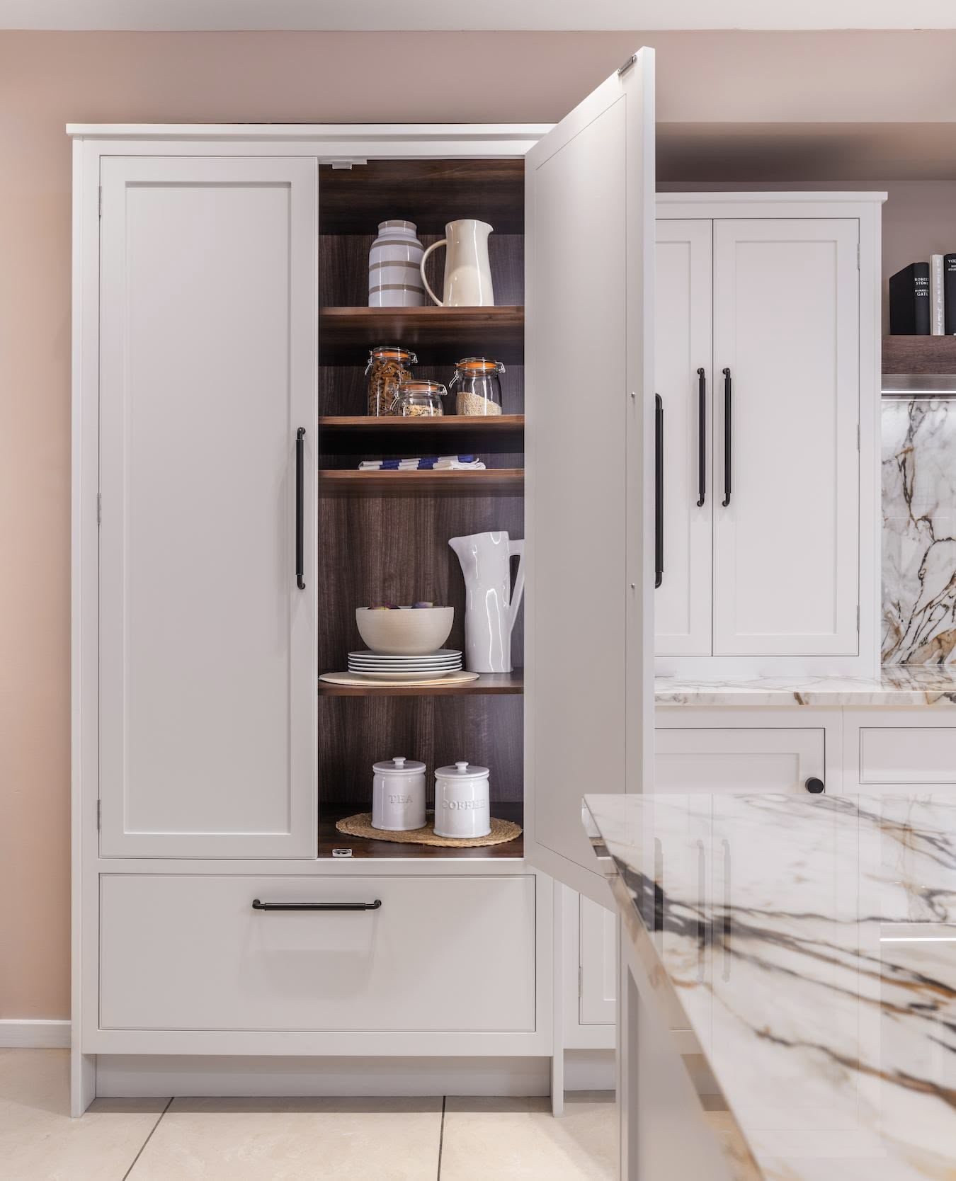 White open large pantry doors showing organised storage
