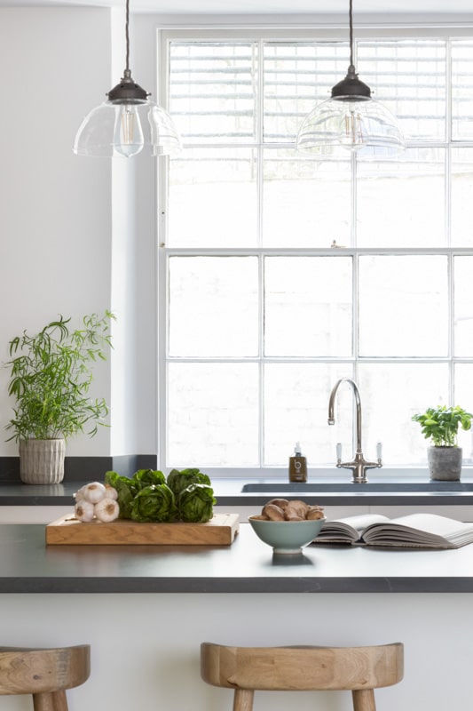 White Arbor kitchen design featuring a black worktop