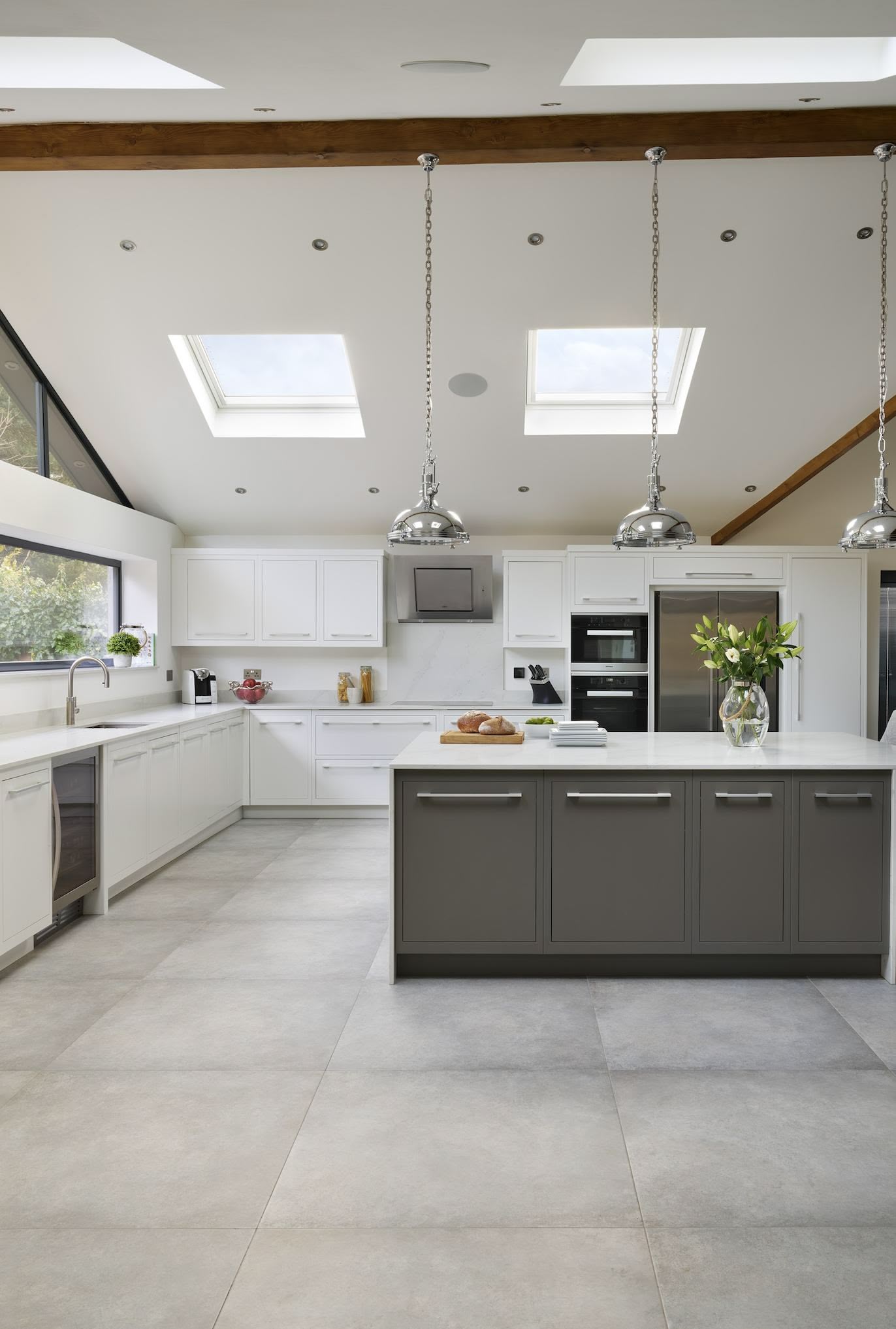Minimalist kitchen design with a muted white and grey colour scheme