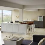 Linear kitchen featuring low level design next to open plan living area