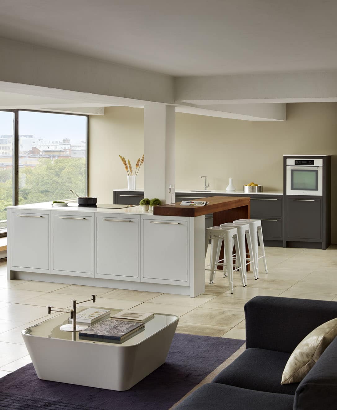 Linear kitchen featuring low level design next to open plan living area