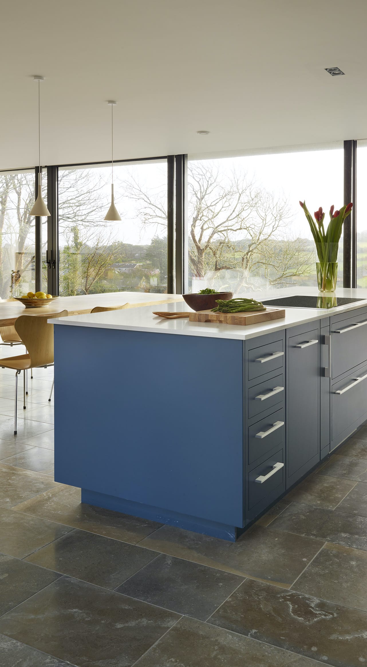 Harvey Jones blue kitchen island with grey worktop and silver handles