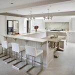 White Original kitchen design featuring bench seating and breakfast bar with white stools
