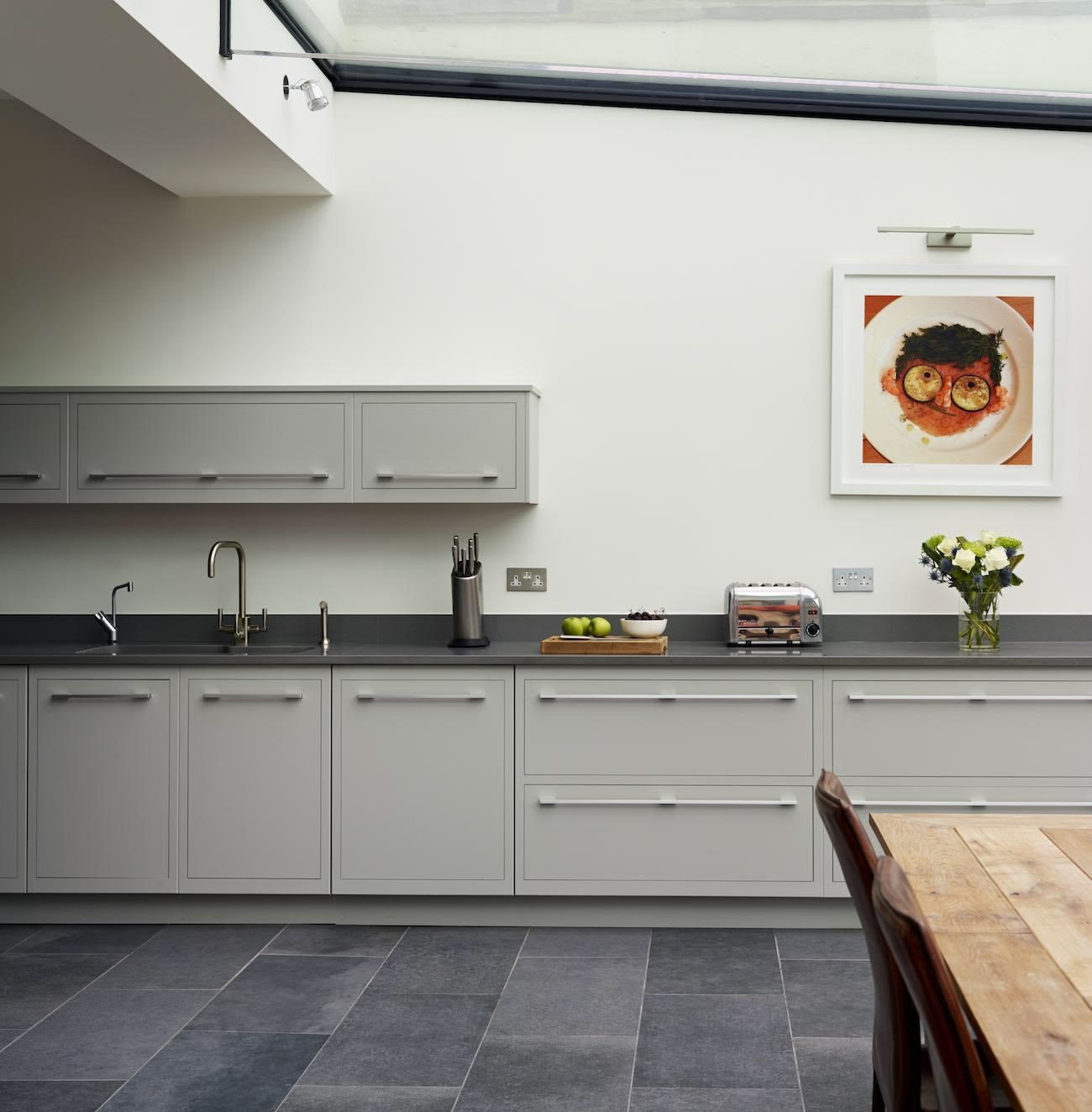 Grey Linear kitchen design with black worktop