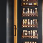 Dark Arbor pantry door featuring organised storage