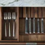 Arbor kitchen drawer open featuring wooden cutlery dividers