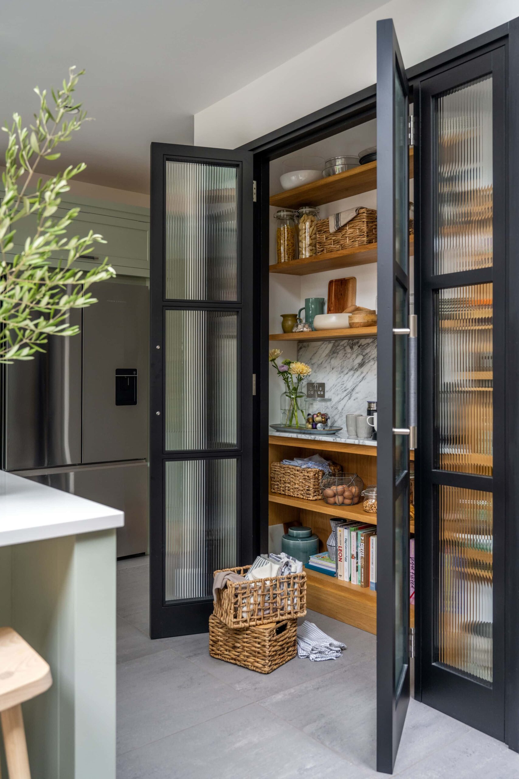Open dark Arbor kitchen pantry with organised storage