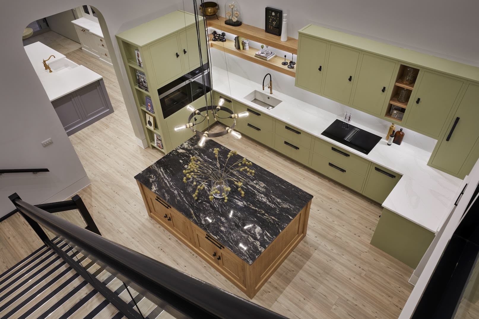 Areal view of green Linear Kitchen display in Harvey Jones showroom