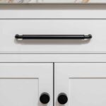 Closeup of white Arbor cabinetry featuring black handles