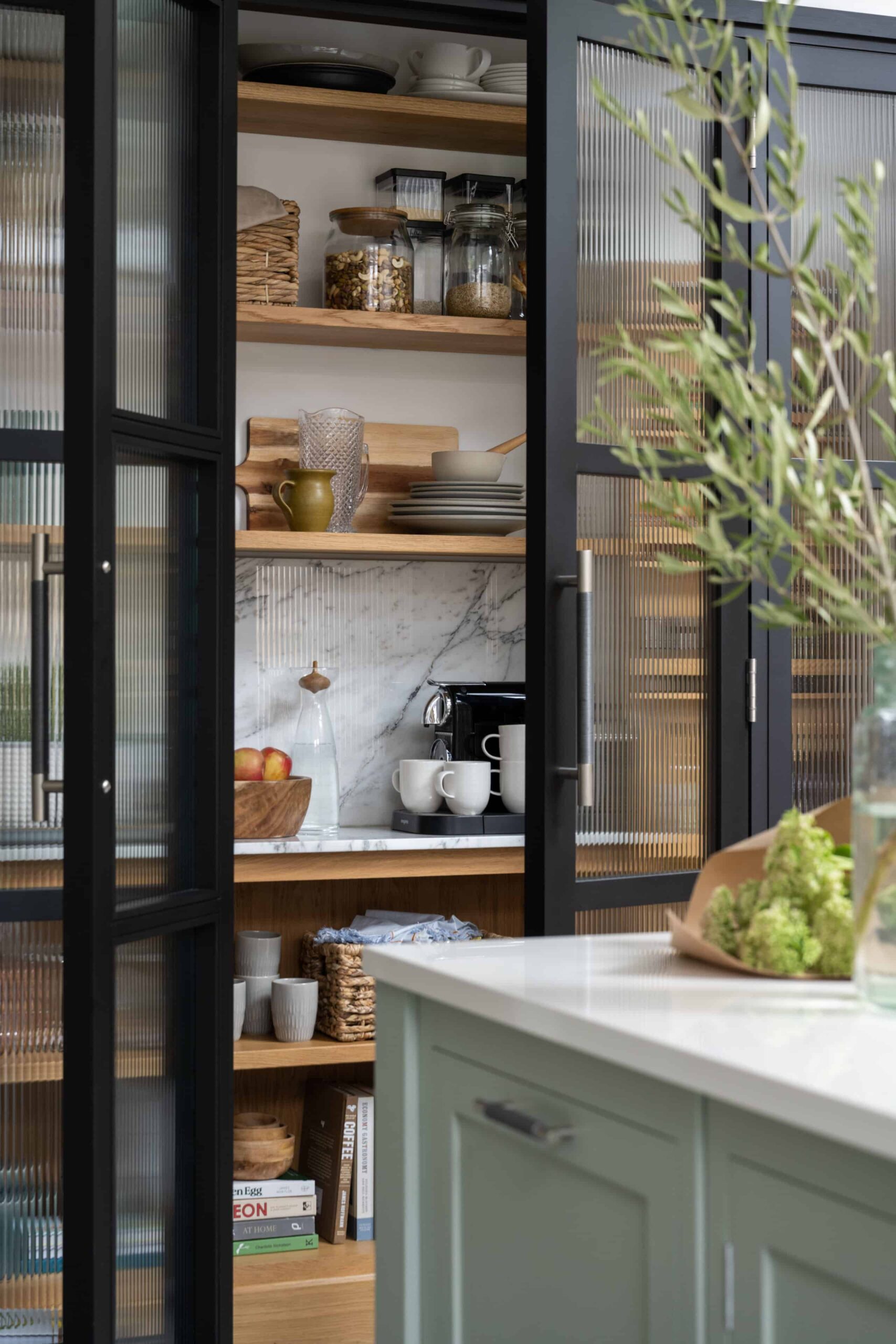 Dark Arbor kitchen pantry open to show organised storage