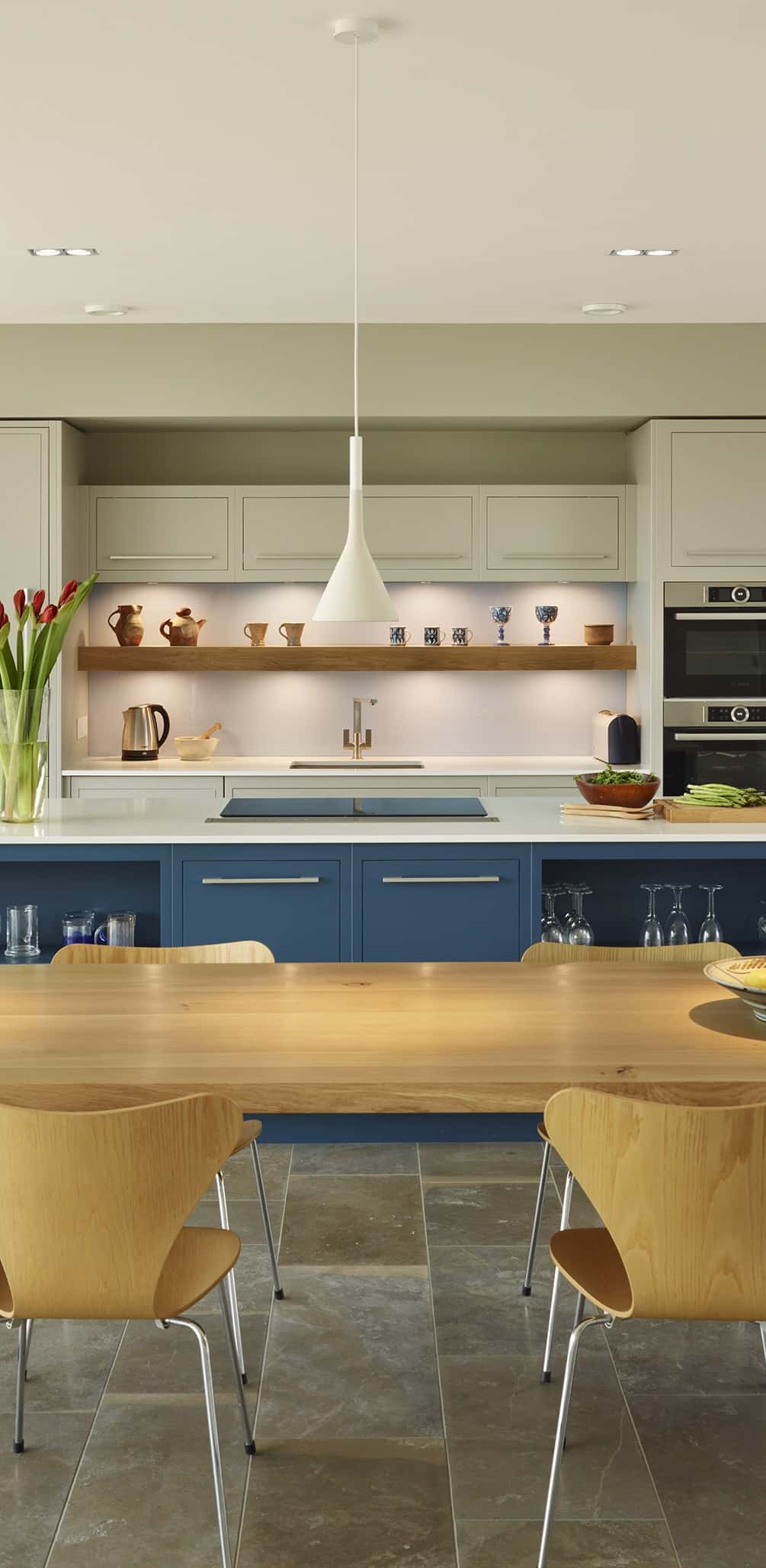 Striking blue kitchen island with secret pantry