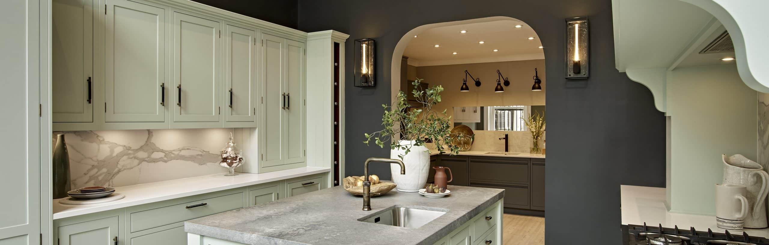 Pale green kitchen design in a Harvey Jones showroom