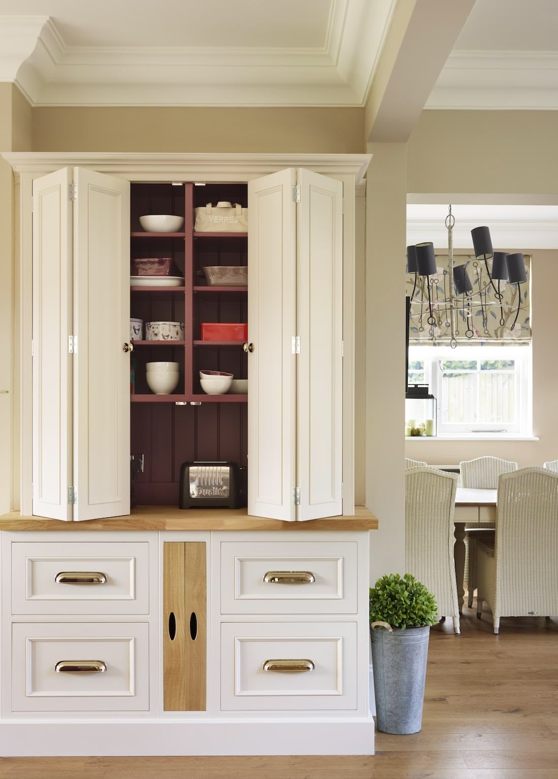 Harvey Jones white kitchen dresser open to show organised shelving