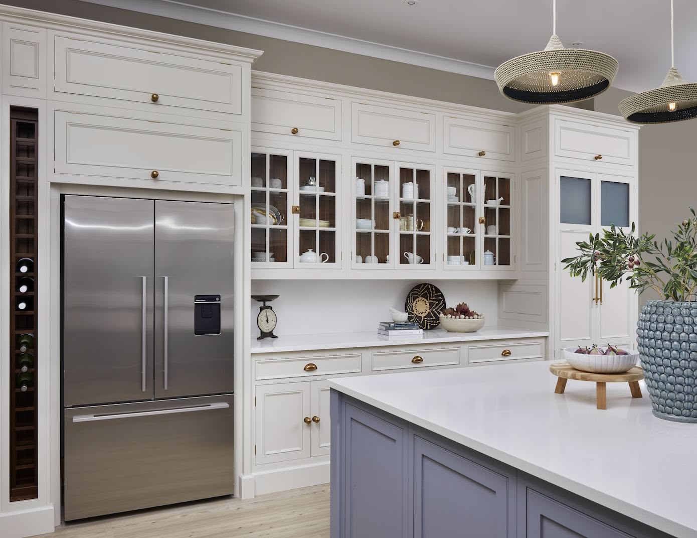 Cream Original design kitchen featuring white cabinetry with framed glass doors