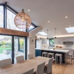Open plan white Shaker kitchen and dining area