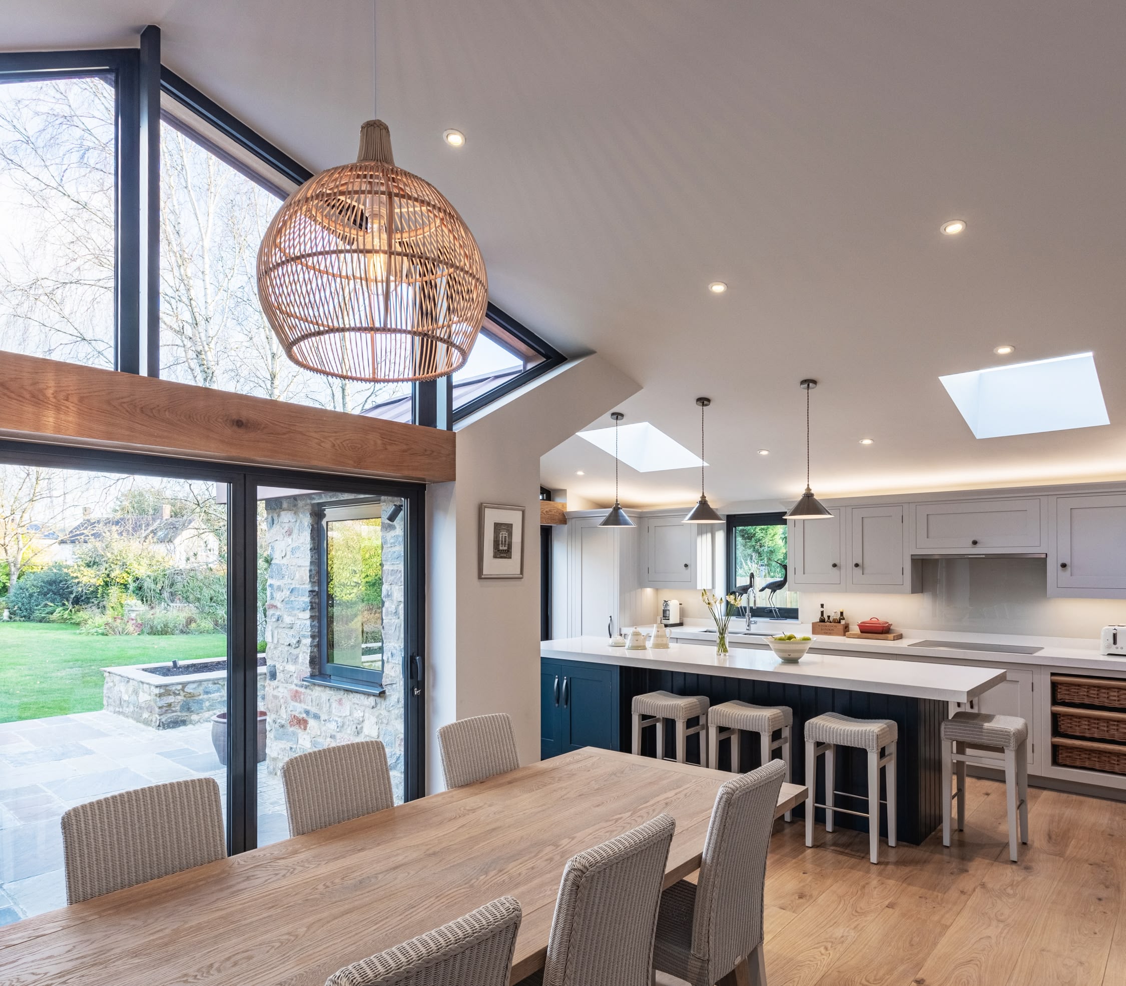 Open plan white Shaker kitchen and dining area