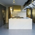 Minimalist Linear Edge kitchen design featuring statement island