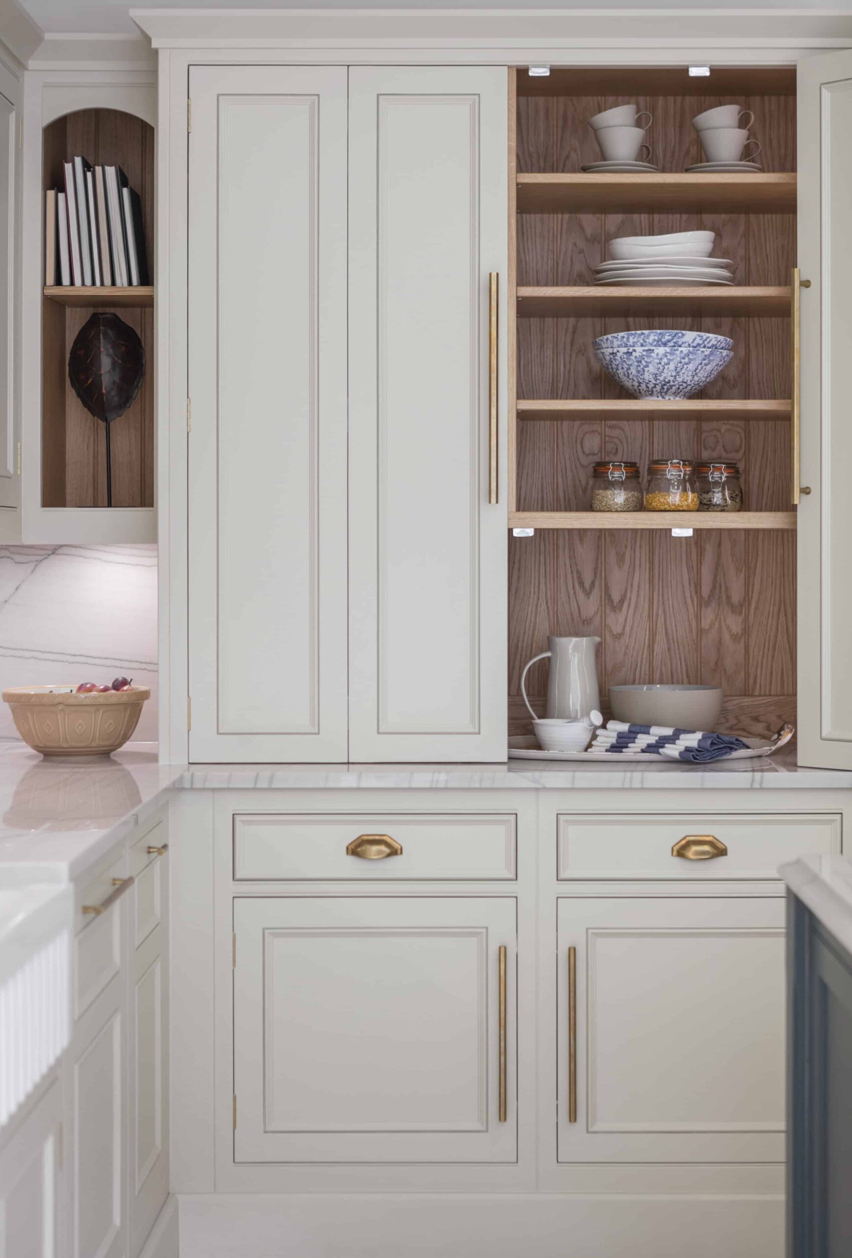 Harvey Jones white kitchen dresser open to show organised shelving