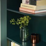 Rich green curved corner open shelving