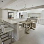 Kitchen dining nook featuring white bench seating