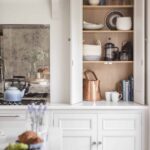 Harvey Jones white kitchen dresser open to show organised shelving