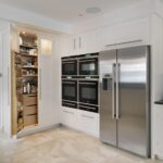 White open large pantry doors showing organised storage