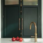 Large vibrant green double pantry doors